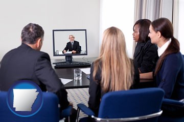 businesspeople participating in a video conference - with Arkansas icon