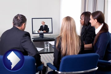 businesspeople participating in a video conference - with Washington, DC icon
