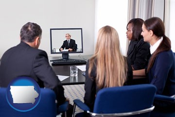 businesspeople participating in a video conference - with Iowa icon