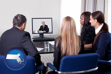 businesspeople participating in a video conference - with Massachusetts icon
