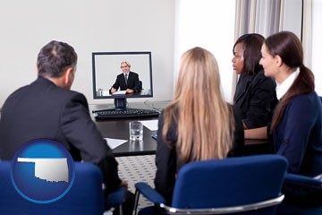 businesspeople participating in a video conference - with Oklahoma icon